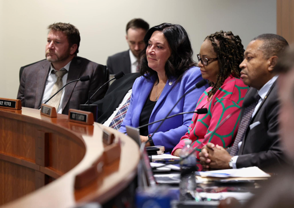 Michigan State Representative Angela Witwer sitting with colleagues at the Select Committee on Protecting Michigan Employees and Small Businesses meeting.