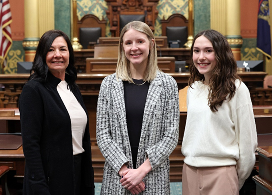 A photo of Michigan State Representative Angela Witwer's office staff on the House Floor.