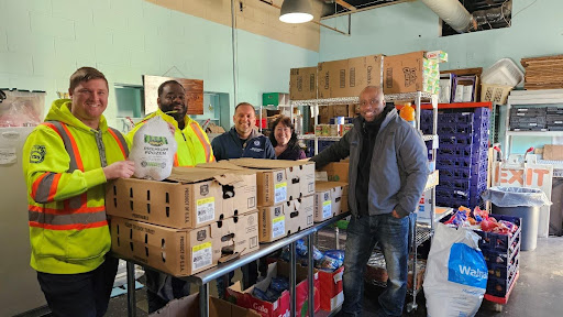 Michigan State Representative Mike McFall distributes food at Madison Heights food pantry