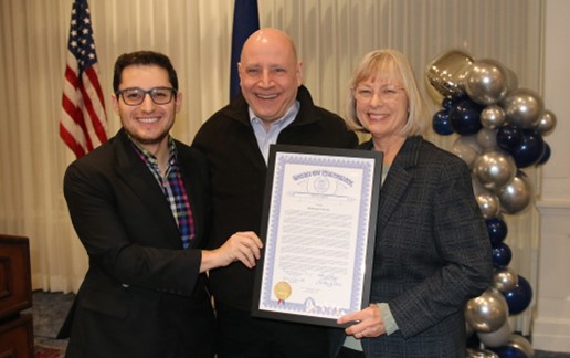 Michigan State Representative Noah Arbit and Michigan State Senator Rosemary Bayer presenting Chief Mike Patton with a framed certificate honoring him on his retirement.