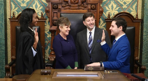 Michigan State Representative Noah Arbit being ceremoniously sworn into the 103rd Legislature by Michigan Supreme Court Justice Kyra Harris Bolden.