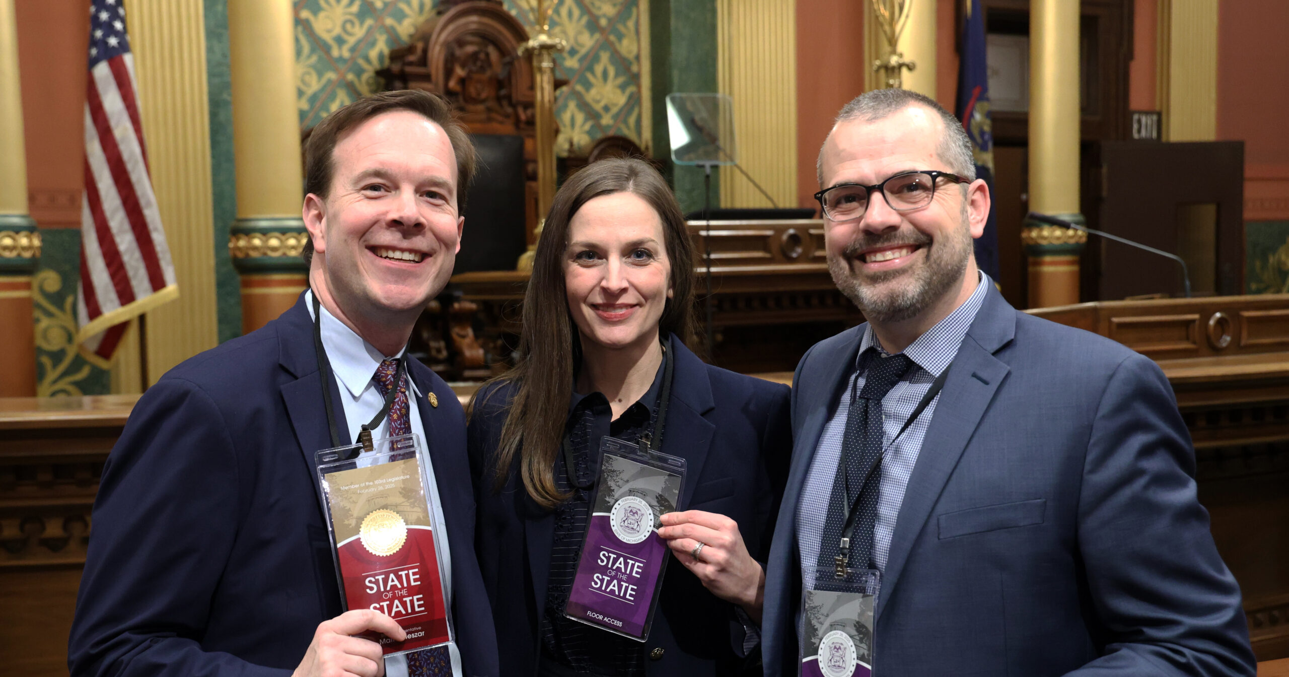 Michigan State Representative Matt Koleszar posing for a photo with John and Liz Carter on the House floor.