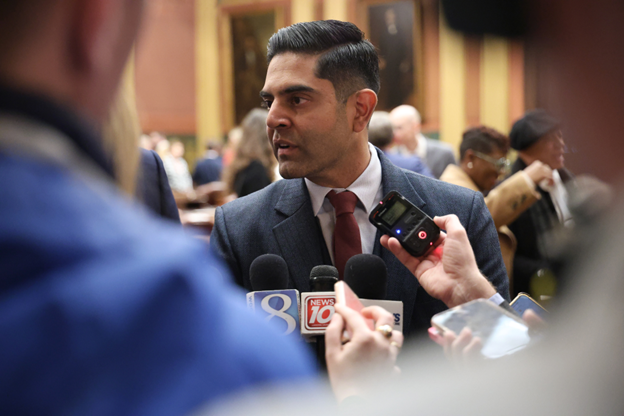 Michigan State Representative Ranjeev Puri speaks to reporters on the House floor.