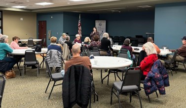 Michigan State Representative Kara Hope speaks to constituents at a coffee hour.