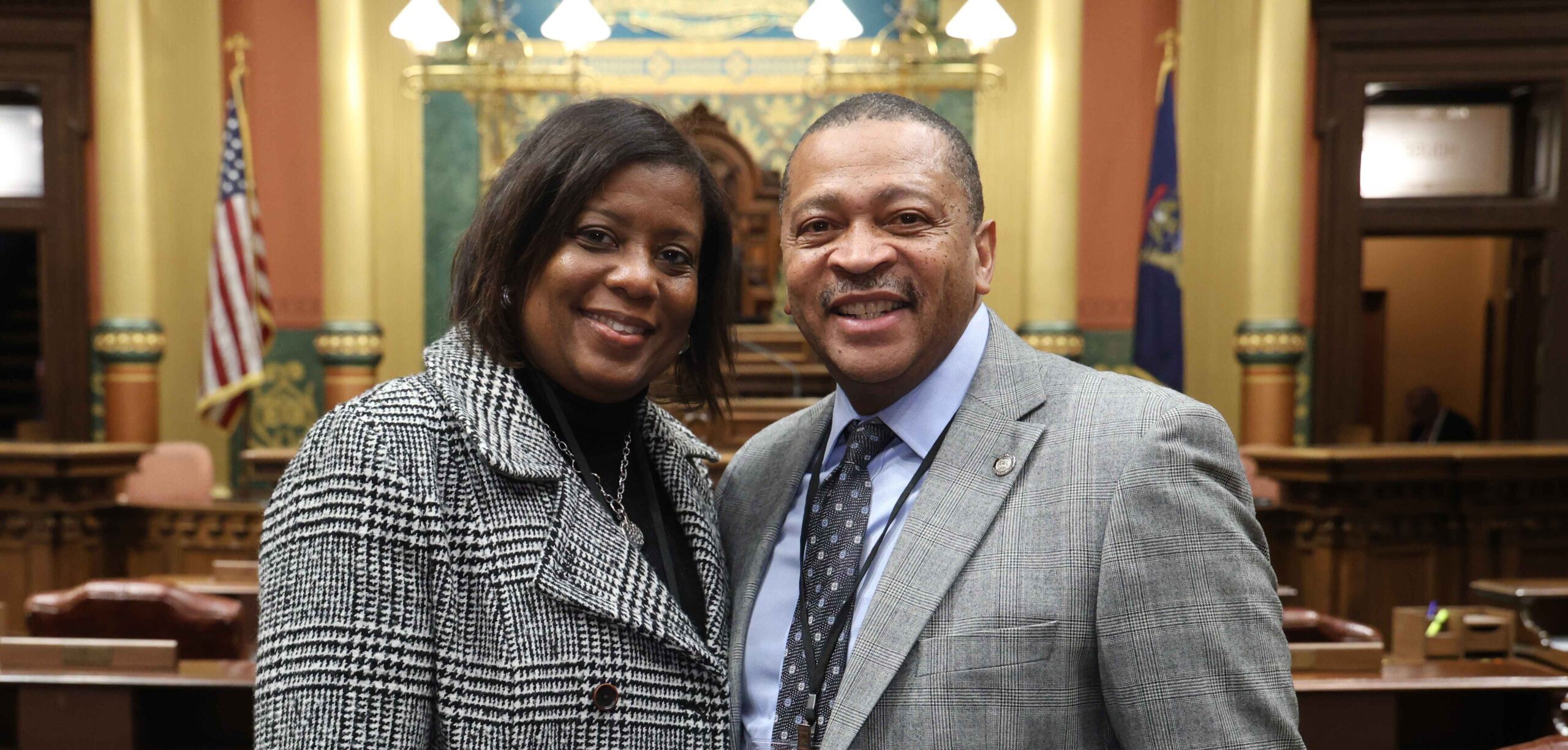 State Rep. Tyrone Carter and his guest on the House floor on Wednesday, Feb. 26, 2025 at the Capitol Building in Lansing.