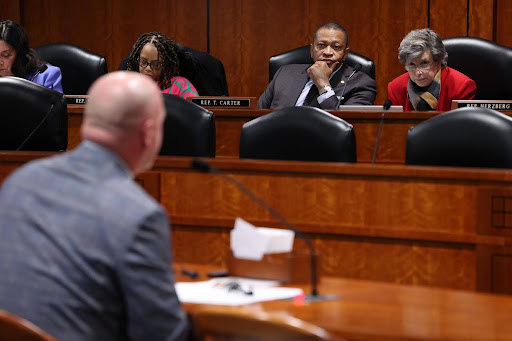 State Rep. Tyrone Carter sitting on a committee at the Anderson House Office Building in Lansing. 