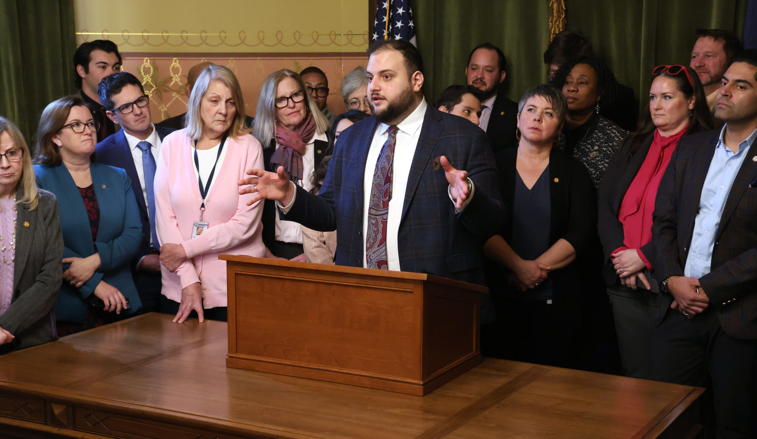 Michigan State Representative Alabas Farhat speaks at a press conference.