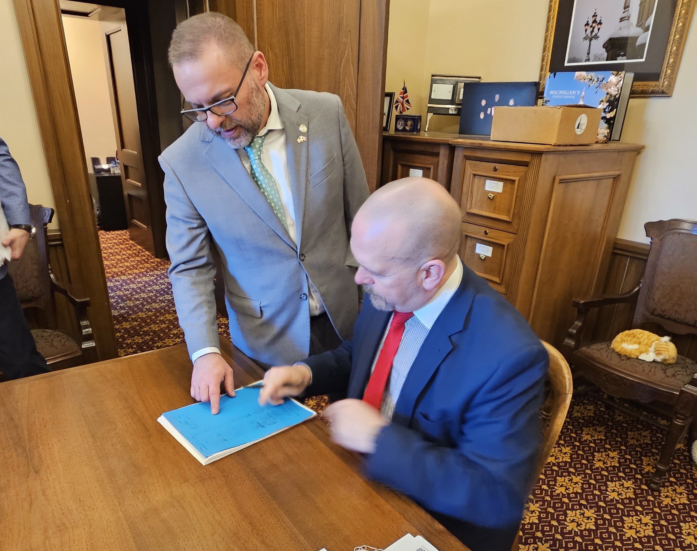 State Reps. Mike McFall and Mike Harris dropping off their bill language for House Bills 4262 and 4263 at the Capitol in Lansing.