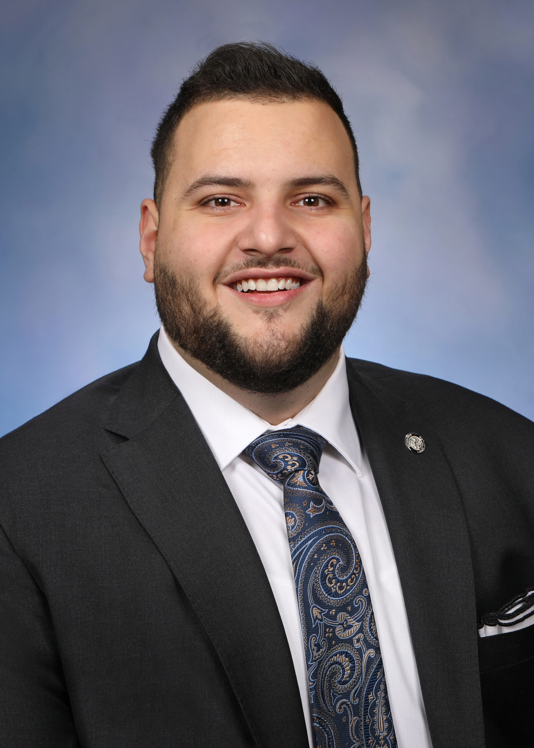 A headshot of Michigan State Rep. Alabas Farhat.