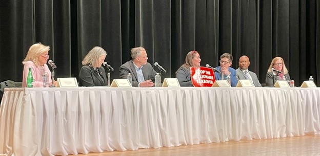 Michigan State Representative Carrie Rheingans speaks at a Town Hall with other legislators. 