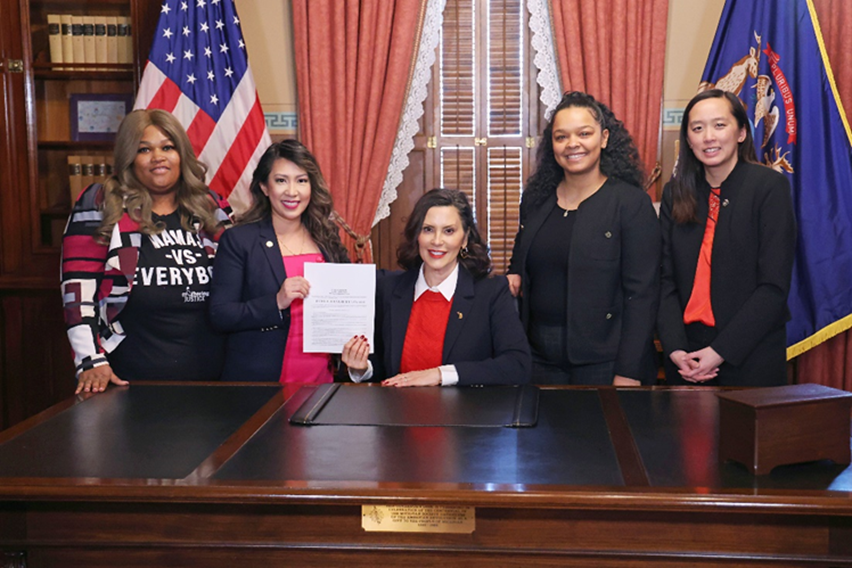 A photo of Michigan State Representative Mai Xiong and colleagues standing with Governor Gretchen Whitmer in her office.