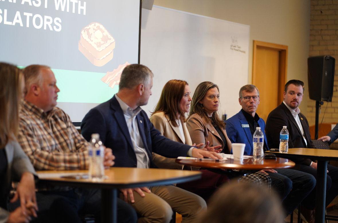Michigan state Representative John Fitzgerald speaking on a panel alongside colleagues.