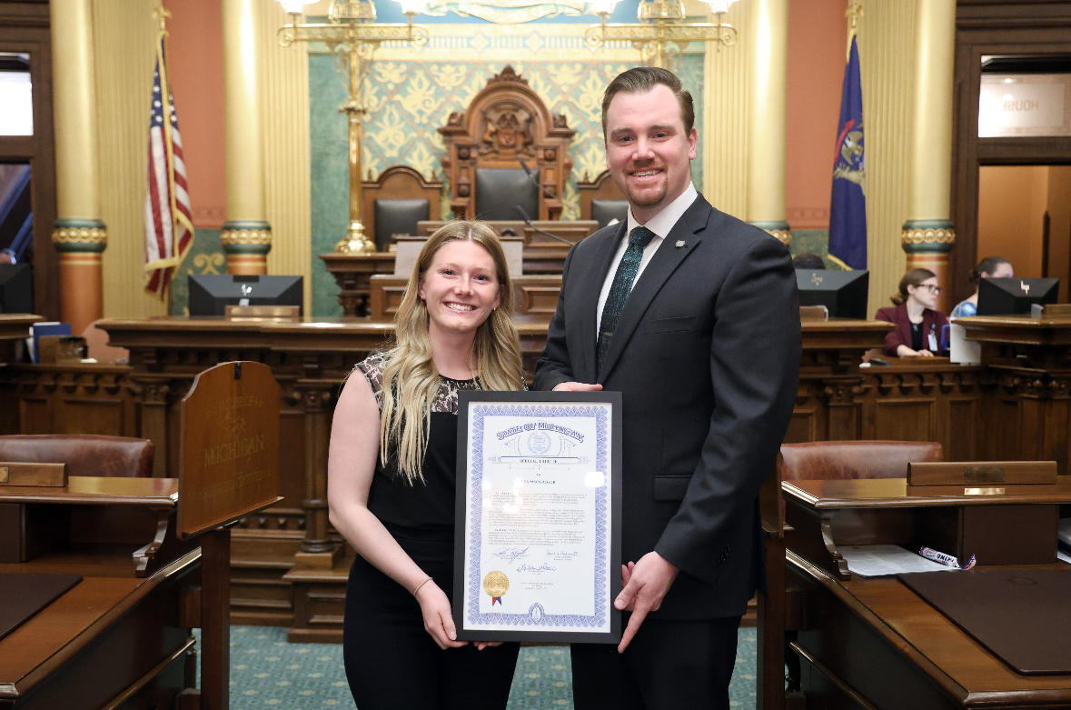 Michigan state Representative John Fitzgerald and Lea McGregor posing for a photo on the House floor.