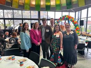 Michigan state Representative Carol Glanville posing for a photo with colleagues at a lunch event.
