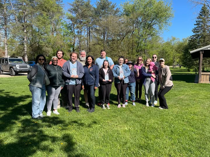 Michigan state Representative Angela Witwer and canvassers on a sunny day.