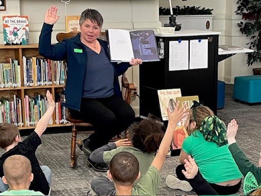 State Rep. Betsy Coffia reading to students at Central Grade School in Traverse City.