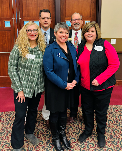 tate Rep. Betsy Coffia, center, meeting with Grand Traverse County township officials in Lansing, including East Bay Township Supervisor Beth Friend in the 103rd House District, right. Also pictured are Fife Lake Township Supervisor Lisa Leedy, Green Lake Township Treasurer Andy Marek, and Green Lake Township Supervisor Marv Radtke from the neighboring 104th House District.