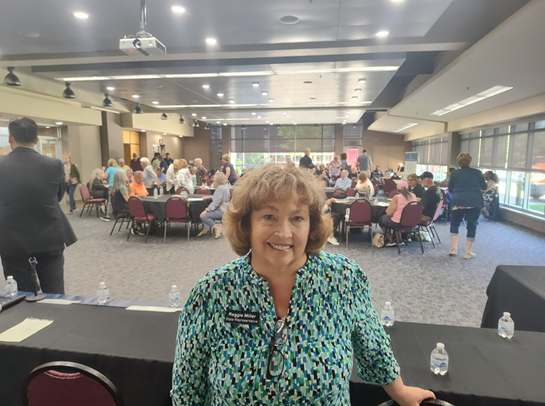 Michigan state Representative Reggie Miller posing for a photo at her senior resource fair.