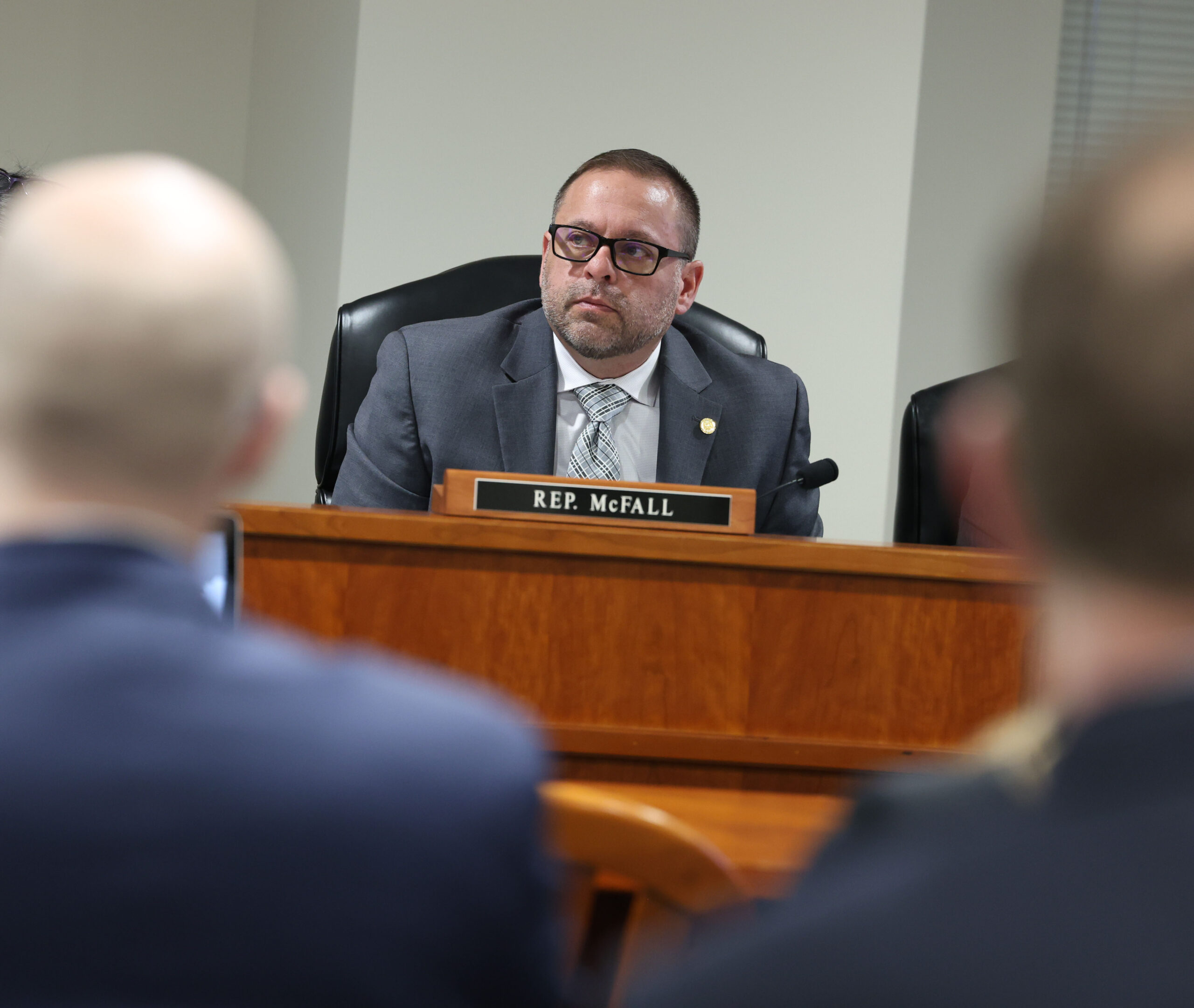 State Rep. Mike McFall sitting on a committee at the Anderson House Office Building in Lansing.