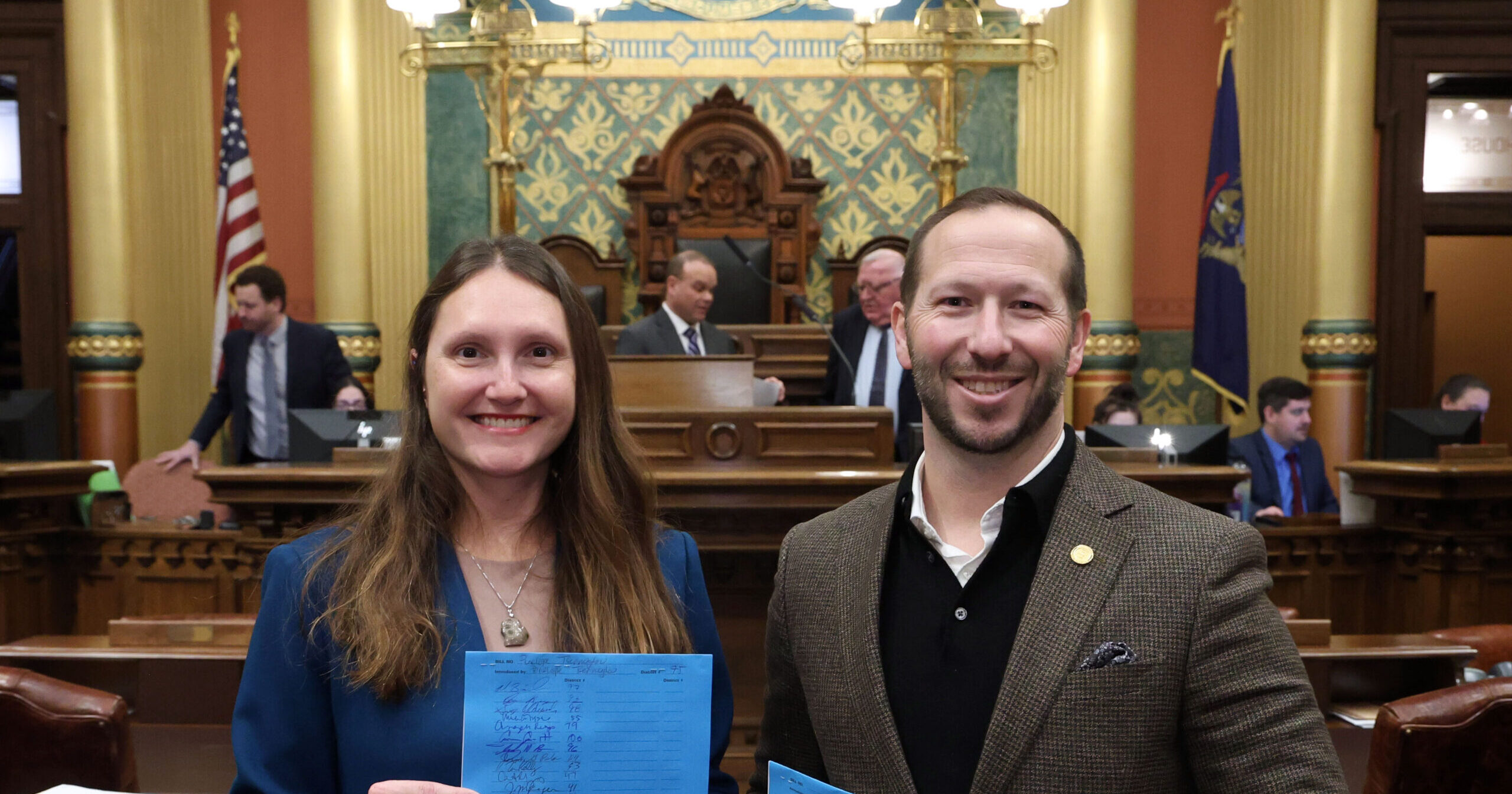 State Reps. Tsernoglou and Bierlien stand on the house floor