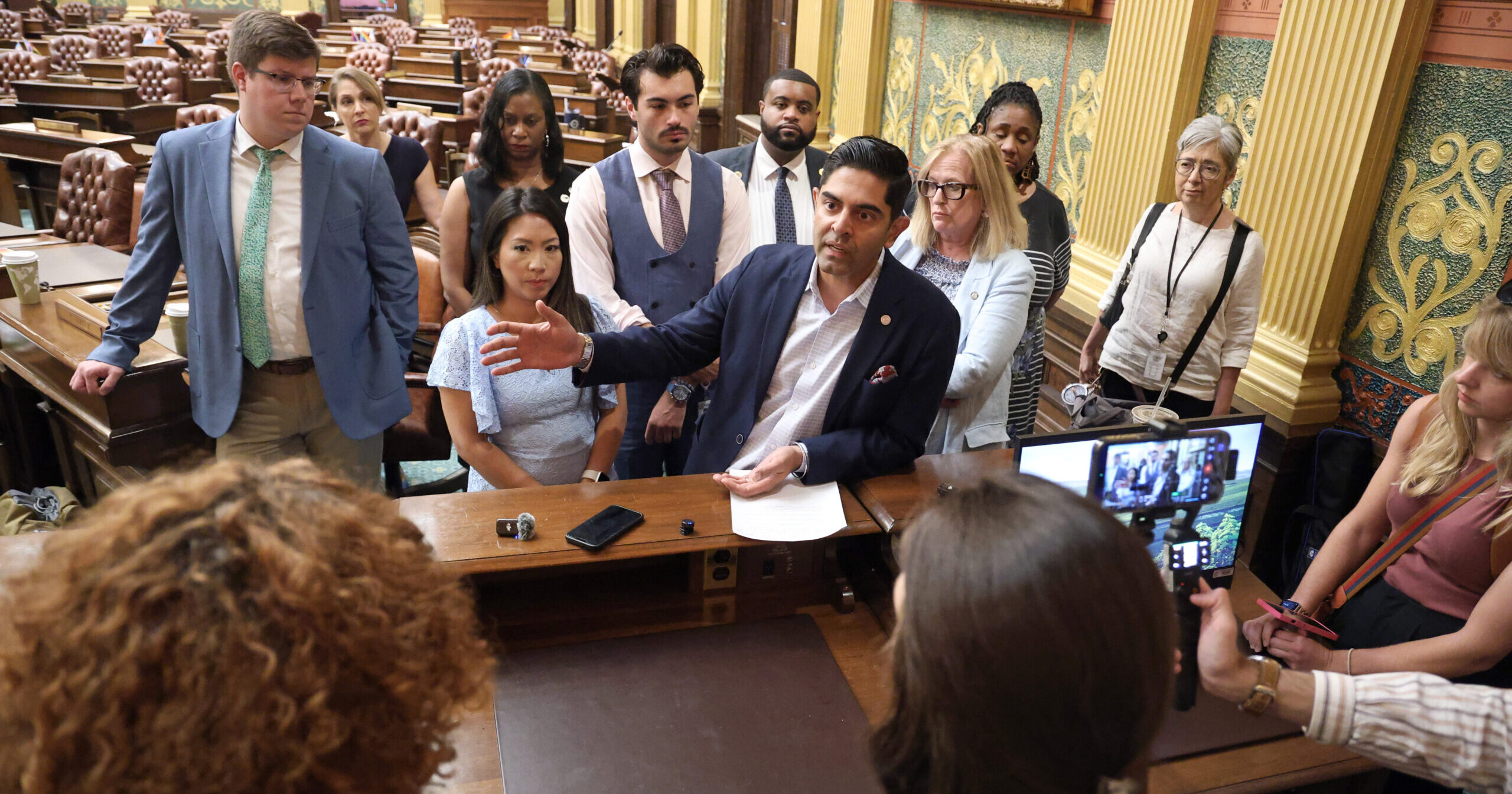 Michigan House Democratic Leader Ranjeev Puri and House Democrats speaking to members of the press on the House floor.