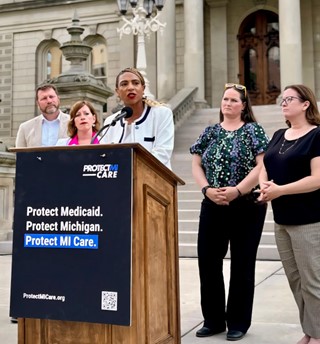 State Rep. Price (right) stands alongside her Democratic colleagues in support of accessible and affordable health care in Michigan.