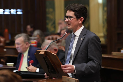 State Rep. Jason Morgan speaking on the House floor at the Capitol building in Lansing.