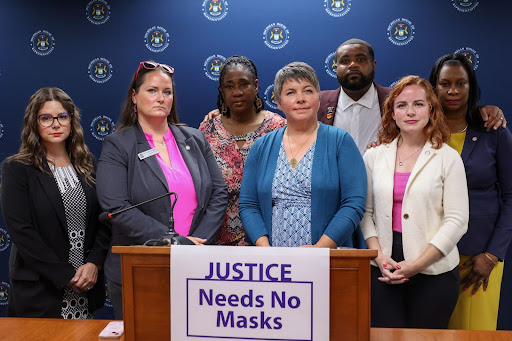 state Reps. Laurie Pohutsky, Carrie Rheingans, Stephanie A. Young, Betsy Coffia, Donavan McKinney, Erin Byrnes,and Tonya Myers-Phillips at the “Justice Needs No Mask” press conference.
