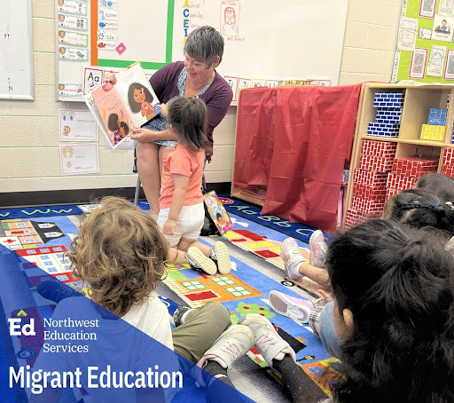 State Rep. Betsy Coffia reading to migrant education students at Northwest Education Services’ Creekside School in Traverse City.