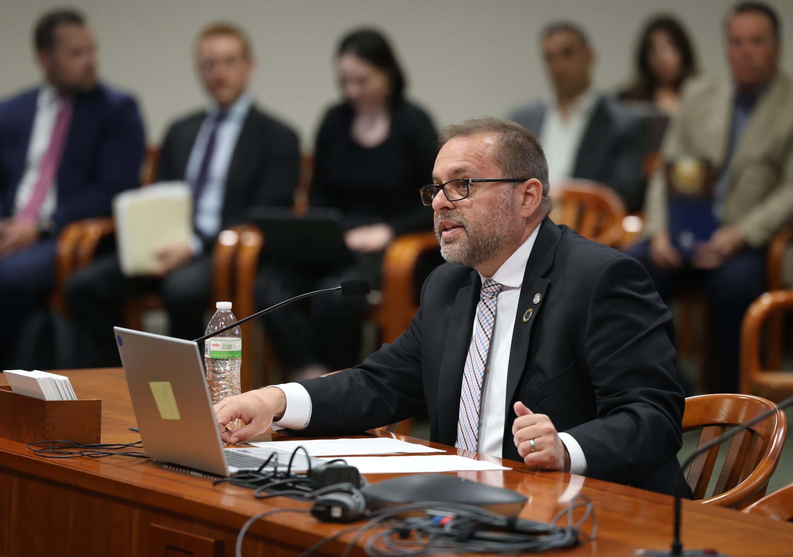 State Rep. Mike McFall testifying in a committee at the Anderson House Office Building in Lansing.