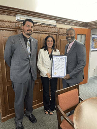 Michigan state Representative Angela Witwer presenting a tribute to members of the Michigan State Employees Association.