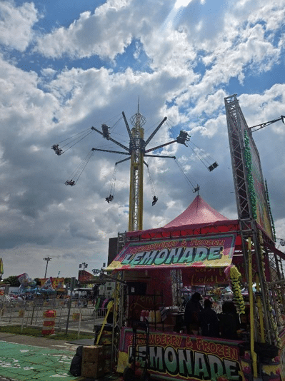 A lemonade stand and rides at Dearborn Homecoming