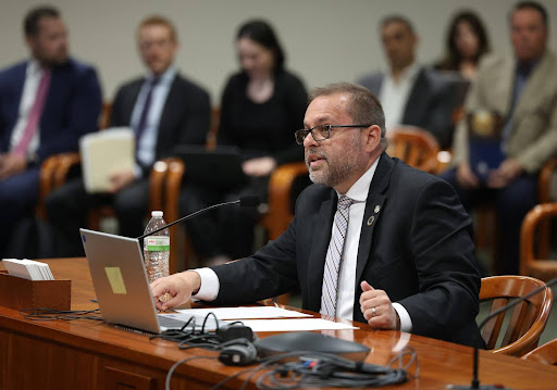 State Rep. Mike McFall testifying in a committee at the Anderson House Office Building in Lansing.