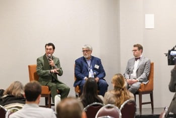 State Rep. Martus speaking with Senator Sam Singh as a part of a panel on the Office of Economic Transition, Oct. 21.