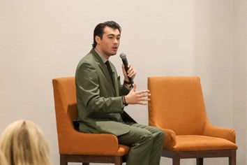 State Rep. Martus speaking with Senator Sam Singh as a part of a panel on the Office of Economic Transition, Oct. 21.