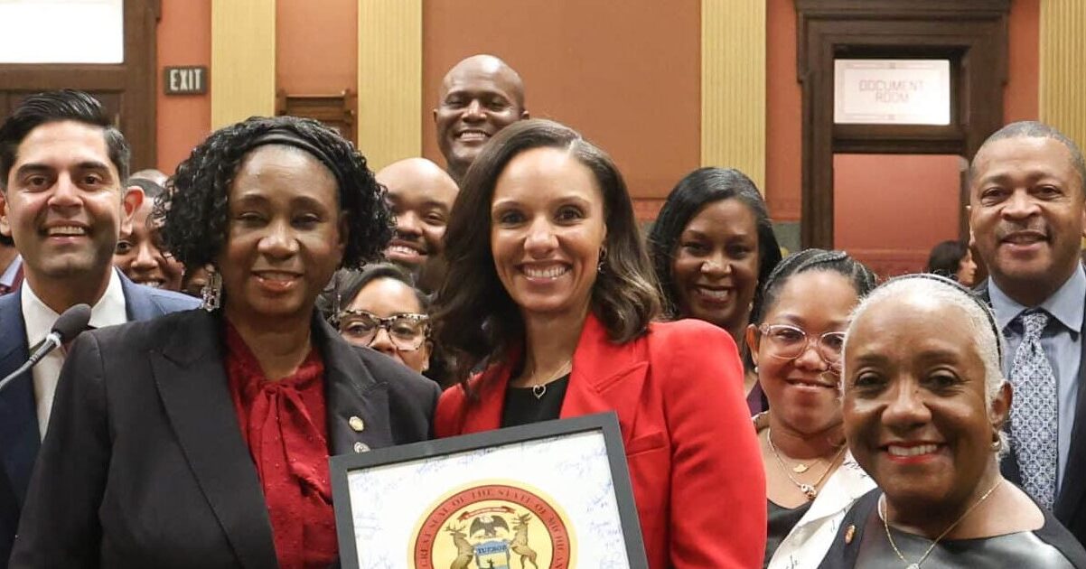 Members of the Detroit Caucus and Michigan Black Legislative Caucus standing with Mayor-Elect Mary Sheffield on the House Floor following the presentation of a state seal on Thursday, Dec. 18, 2025.