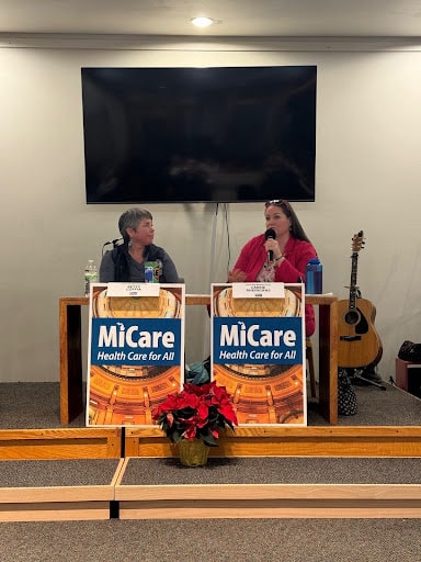 State Reps. Betsy Coffia, left, and Carrie Rheingans, right, speaking at the MiCare Health Care for All Town Hall in Traverse City.