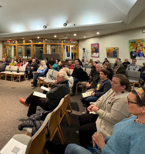 Attendees listening to remarks at the MiCare Health Care for All Town Hall in Traverse City.