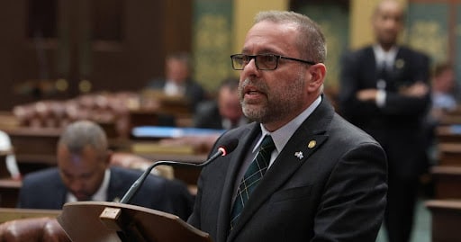 State Rep. Mike McFall (D-Hazel Park) speaks on the House floor at the Capitol building in Lansing.