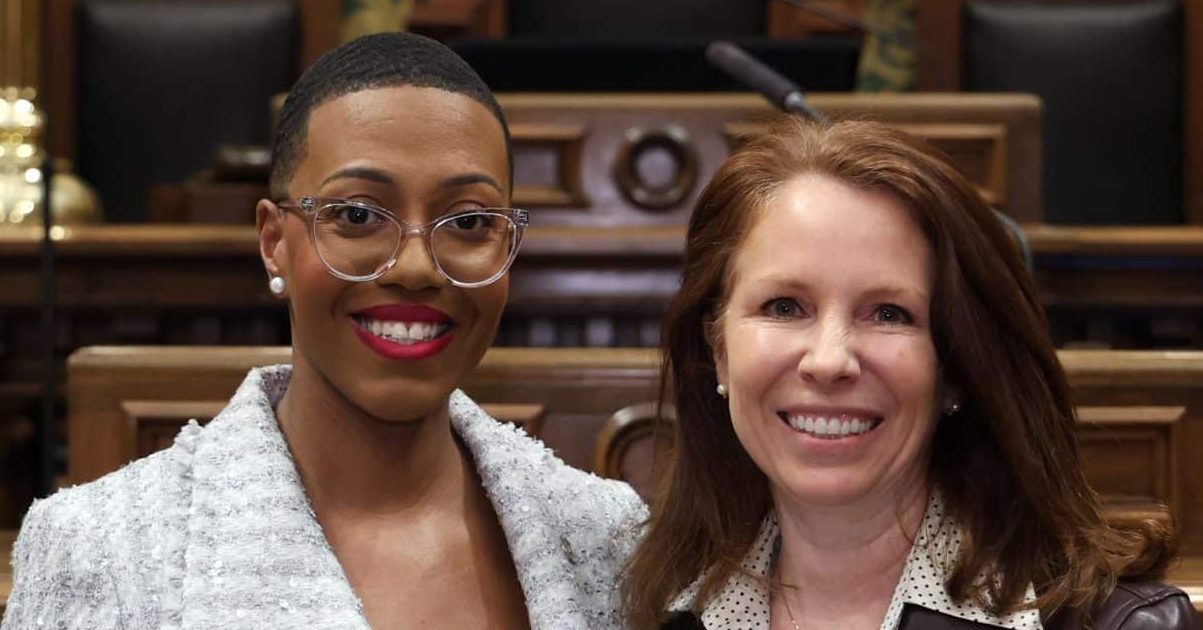 State Rep. Morgan Foreman standing with guest Trish Reilly, Pittsfield Twp. Supervisor at the State of the State address on Wednesday, Feb. 25, 2026 on the House Floor at the Capitol Building in Lansing.