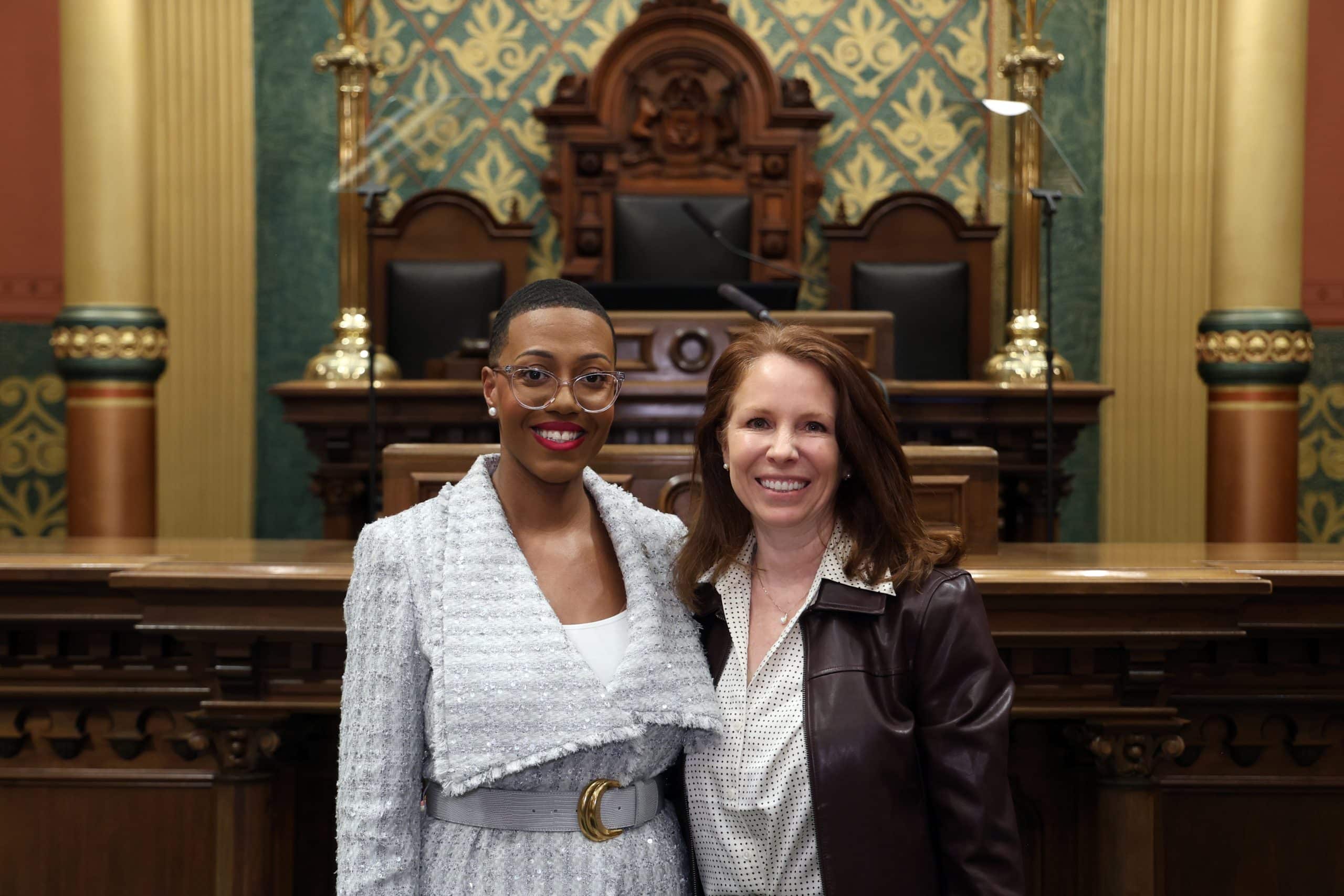 State Rep. Morgan Foreman standing with guest Trish Reilly, Pittsfield Twp. Supervisor at the State of the State address on Wednesday, Feb. 25, 2026 on the House Floor at the Capitol Building in Lansing.