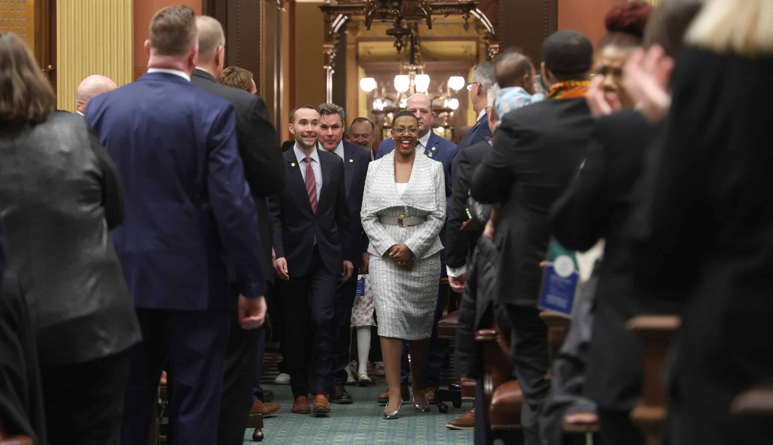 State Rep. Morgan Foreman escorting people into the House Chamber at the State of the State address on Wednesday, Feb. 25, 2026 at the Capitol Building in Lansing.