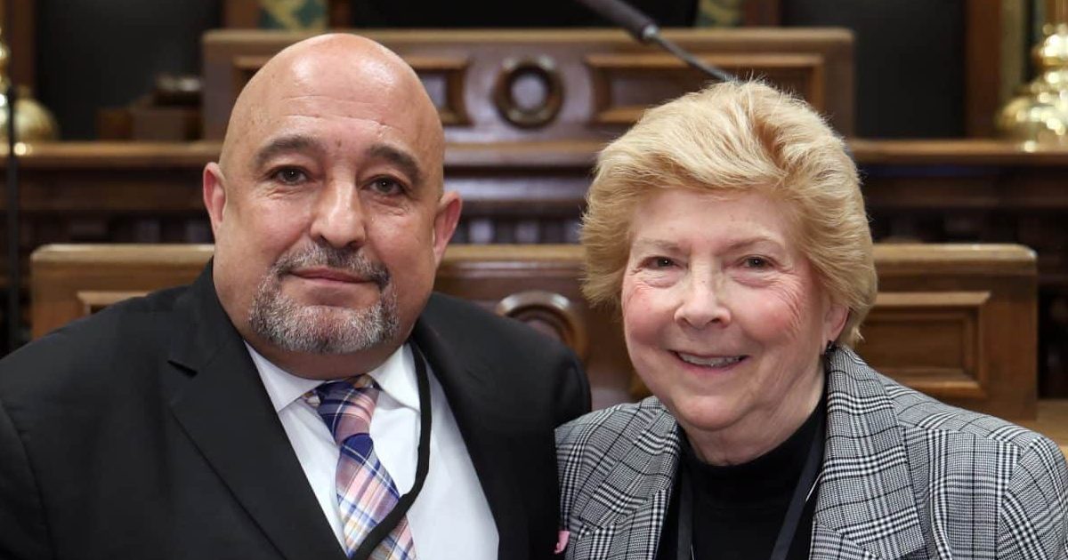 State Rep. Tullio Liberati standing with guest Gail McLeod, Mayor of Allen Park at the State of the State address on Wednesday, Feb. 25, 2026 on the House Floor at the Capitol Building in Lansing.