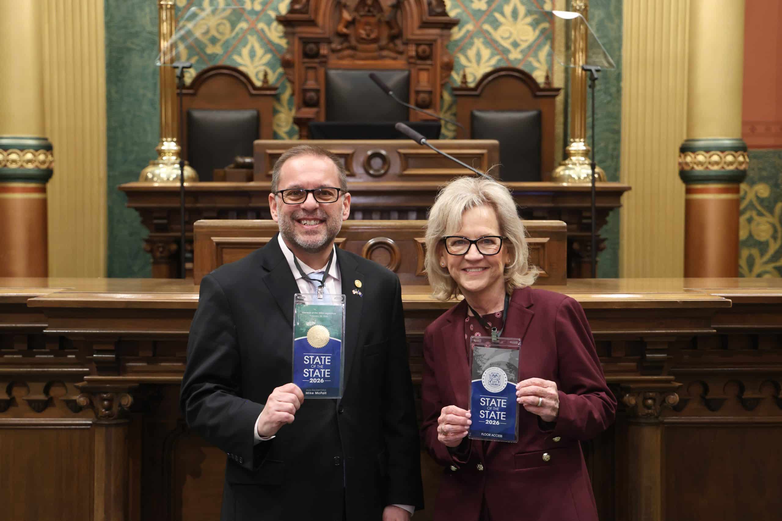 State Rep. Mike McFall standing with guest Mindy Moore, Warren City Council Member, at the State of the State address on Wednesday, Feb. 25, 2026 on the House Floor at the Capitol Building in Lansing.