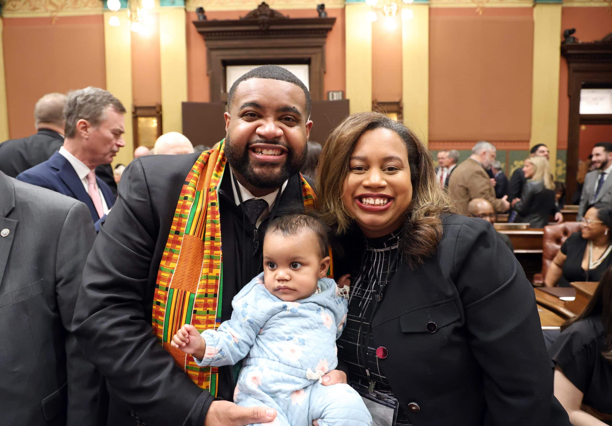 State Rep. Donavan McKinney standing with his wife Shaunte Wilcher at the State of the State Address on Wednesday, Feb. 25, 2026 on the House Floor at the Capitol Building in Lansing.