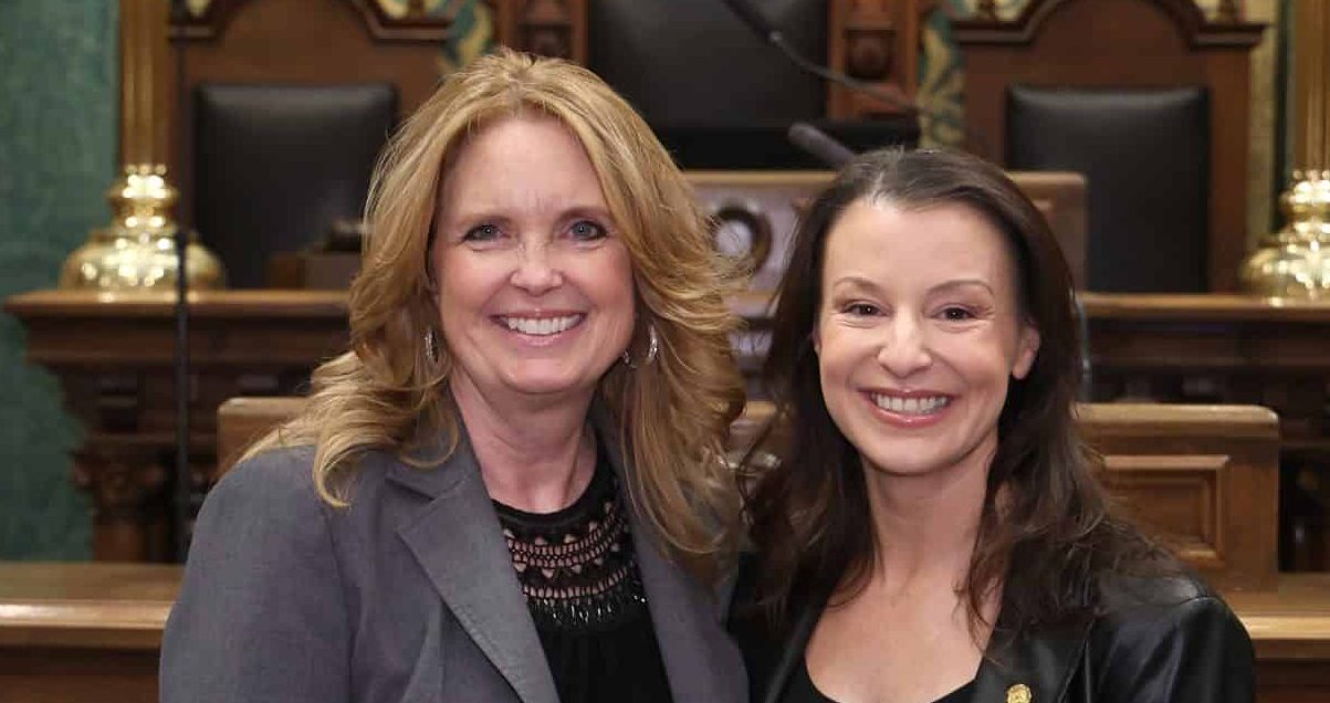 State Rep. Samantha Steckloff (D-Farmington Hills) stands with guest Kelly Coffin, Superintendent of Farmington Public Schools, at the State of the State address on Wednesday, Feb. 25, 2026 on the House Floor at the Capitol Building in Lansing.