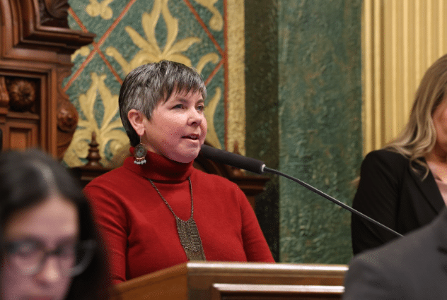 State Rep. Betsy Coffia delivering the invocation on theHouse floor ahead of session on March 3. 