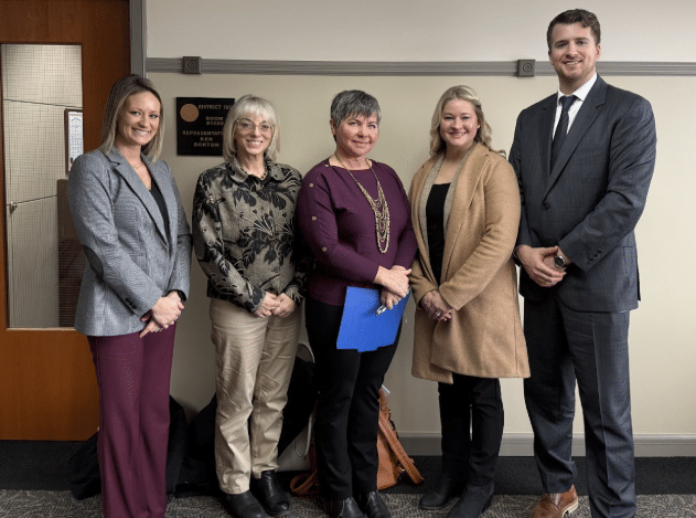 State Rep. Betsy Coffia, center, with Sara Andrus, Jon Willow, Carmen Knott, and Michael Broodo of the Northern Michigan Chamber Alliance.