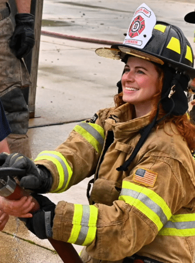 State Rep. Erin Byrnes in a fire fighter's uniform