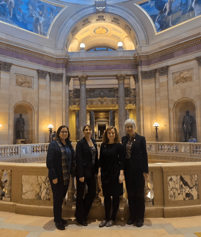 State Reps. Erin Byrnes, Emily Dievendorf, Natalie Price, and Veronica Paiz in the Minnesota state capitol for a day of solidarity